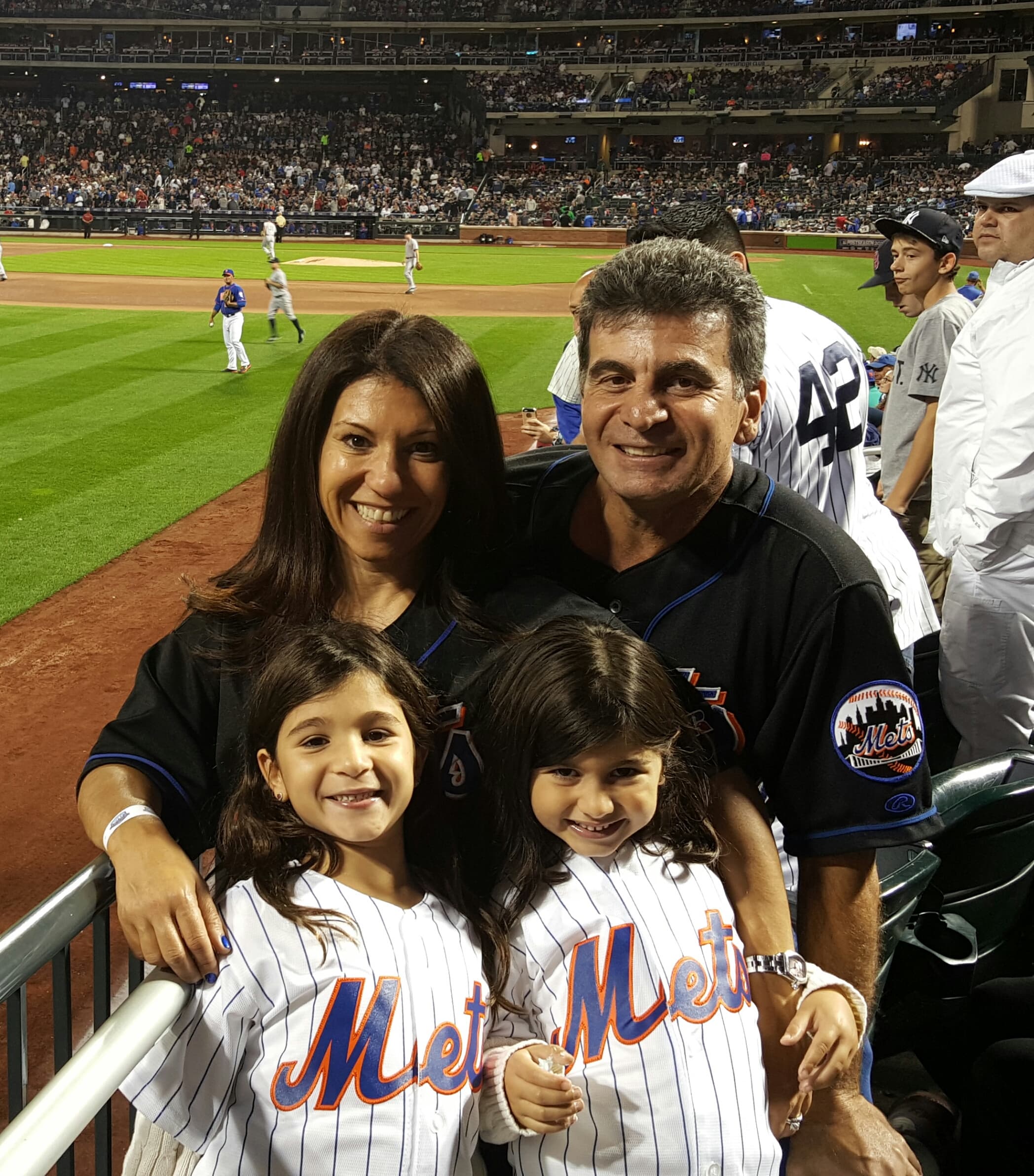 Lori and family at the Mets playoff game last year.