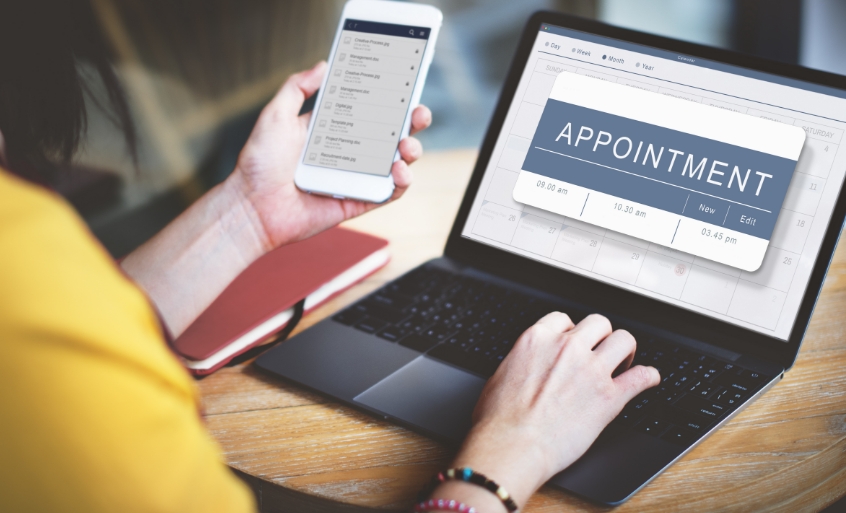 Woman booking an appointment online