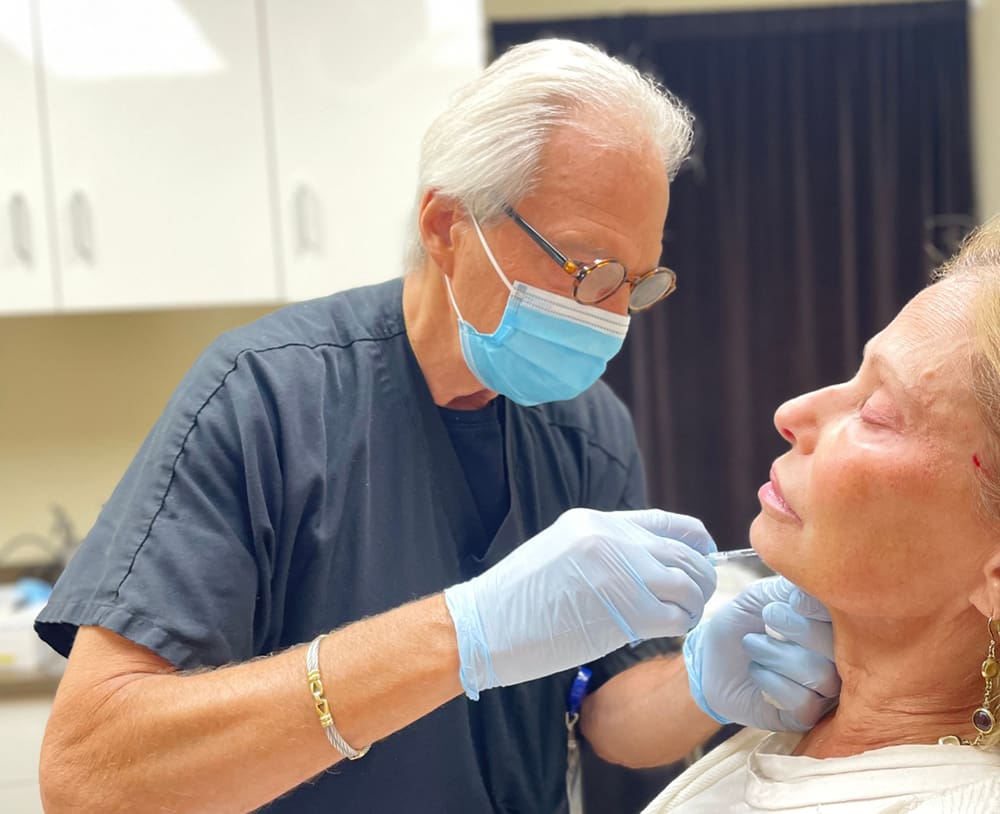 Dr. Lukash with a patient
