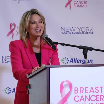 WOman speaking at breast cancer summit